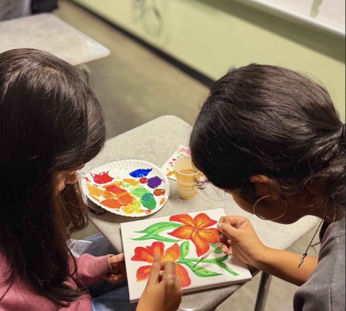 Students painting at BC2M event